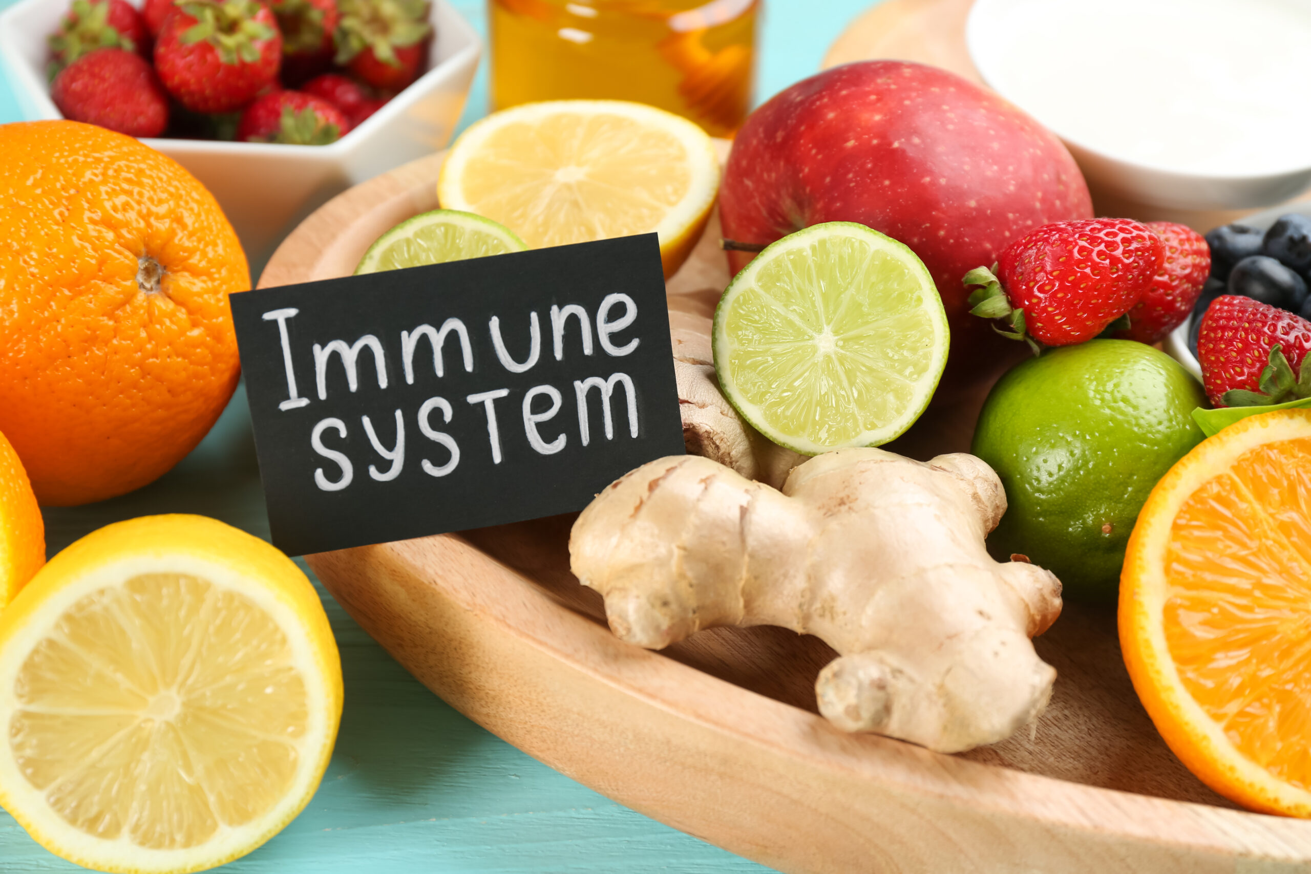 Card with phrase Immune System and fresh products on table, closeup